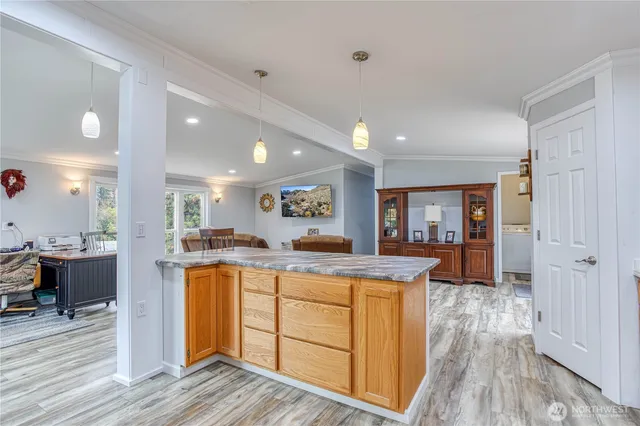 a kitchen with a stove a refrigerator and a microwave