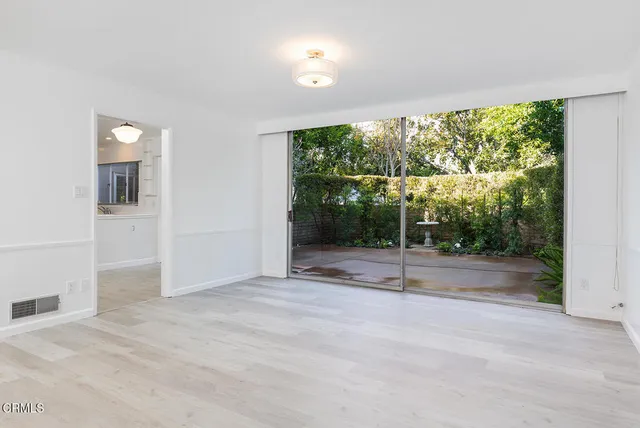 a view of a room with a large window