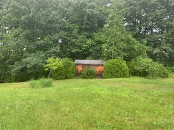 279 Forge Village Road Groton, MA 01450 - Photo 3 of 19 a view of a lush green space