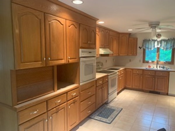 279 Forge Village Road Groton, MA 01450 - Photo 6 of 19 a large kitchen with stainless steel appliances granite countertop a refrigerator and a sink