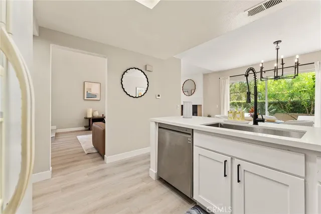 a kitchen with a sink and a large window