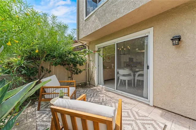 a chairs and table in a balcony
