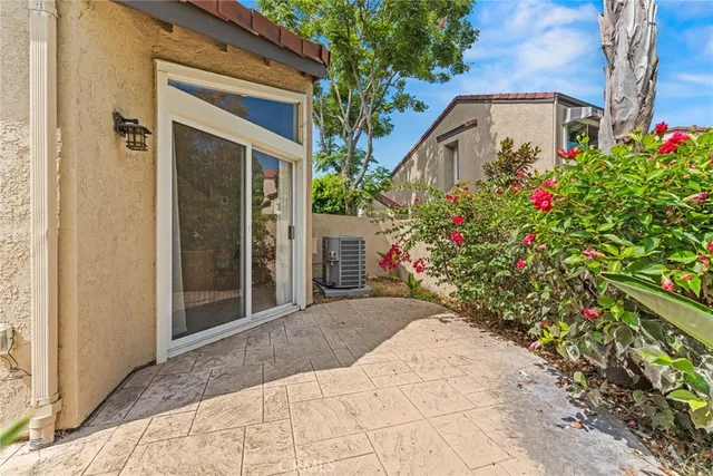 a flower garden is sitting in front of a house