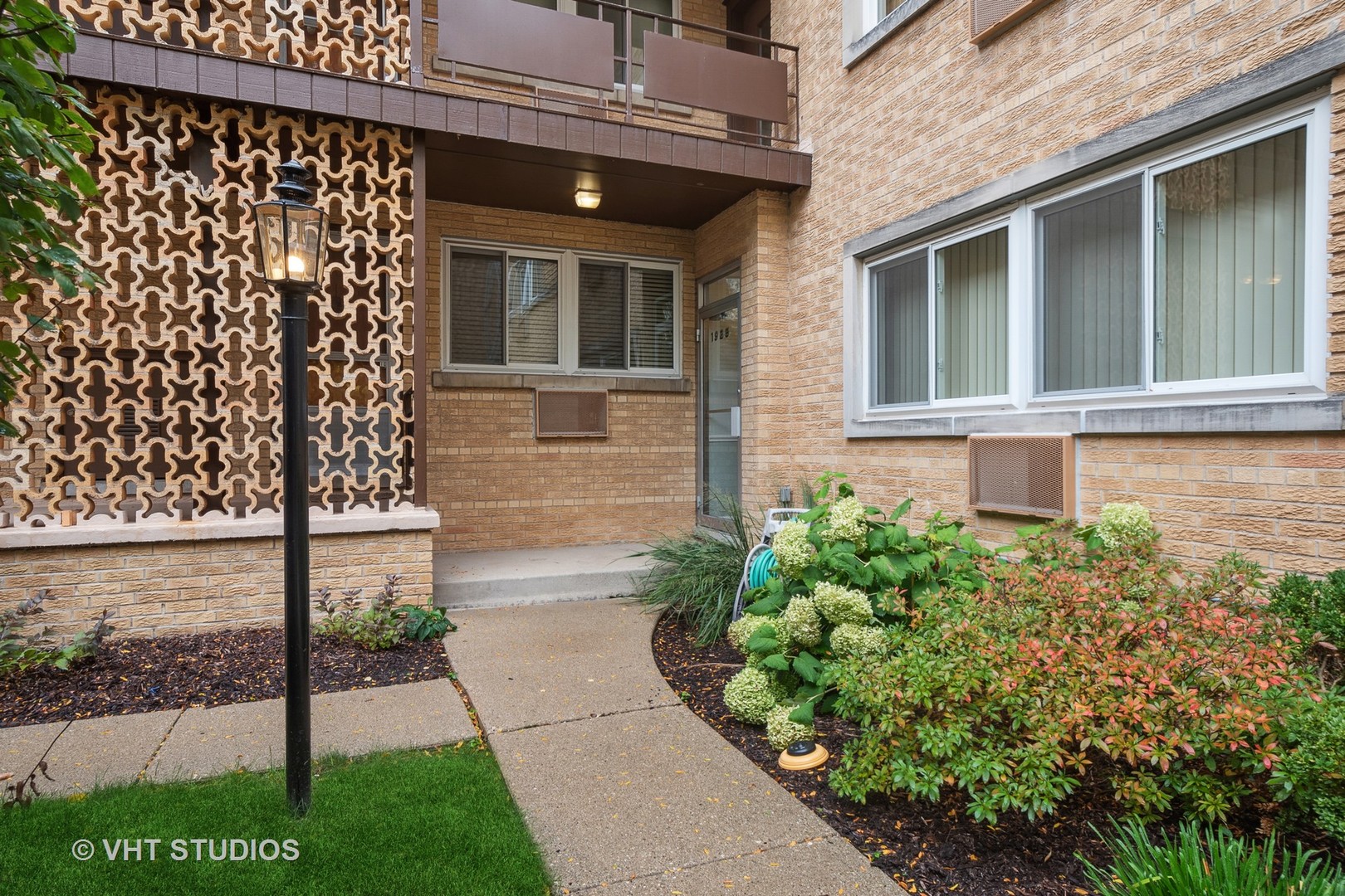 1925 Harrison Street, Unit 3H Evanston, IL 60201 - Photo 3 of 9 a view of a house with a garden