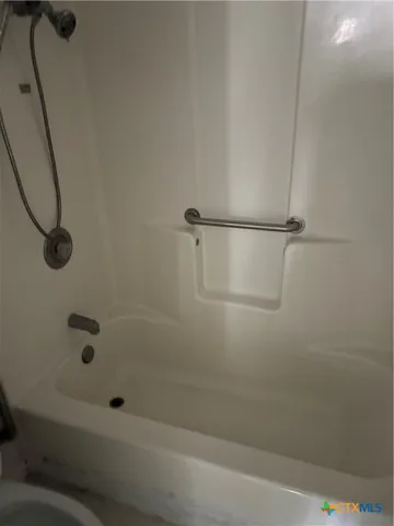 a bathroom with a double vanity sink and mirror