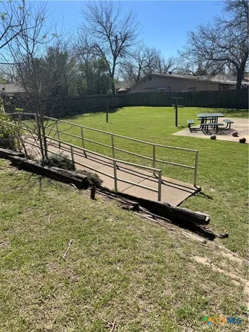 a view of a pool with a yard