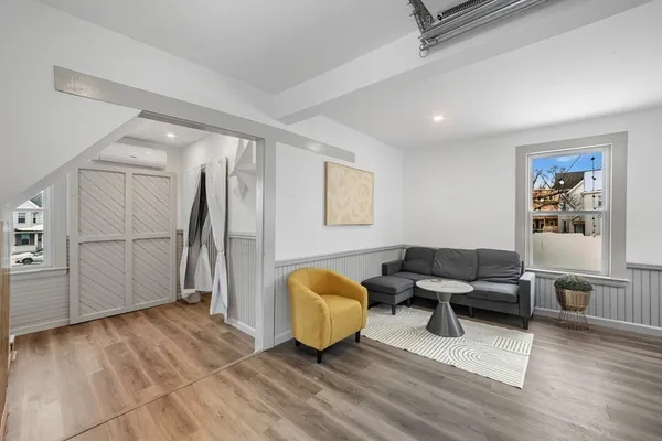 a living room with furniture and a rug