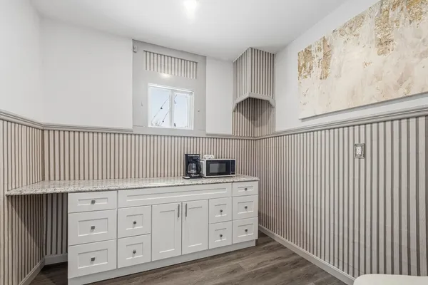 a bathroom with a sink a vanity and a mirror