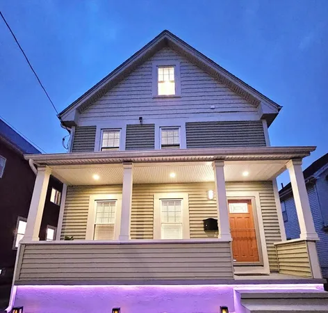 a view of a house with large windows