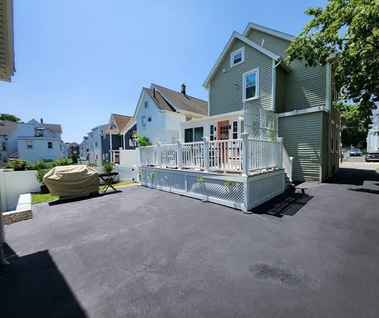 a view of house with truck parked in front of house