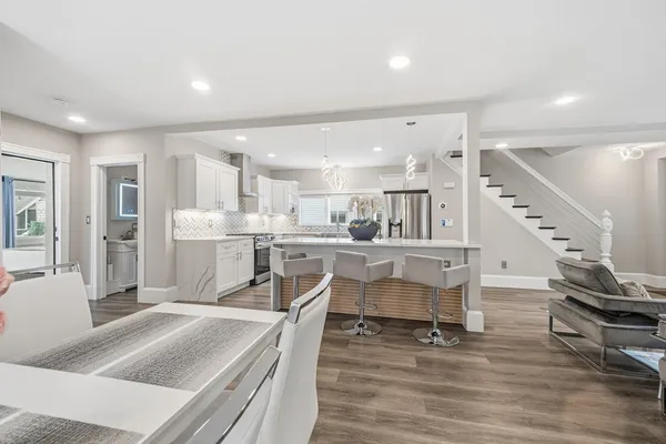 a kitchen with a table and chairs