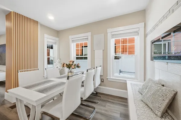 a spacious bathroom with double vanity and a mirror