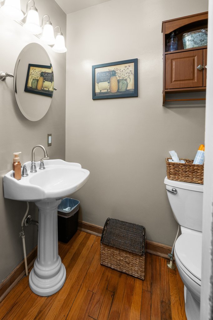 215 West Prospect Street Kewanee, IL 61443 - Photo 23 of 53 a bathroom with a toilet a sink and mirror