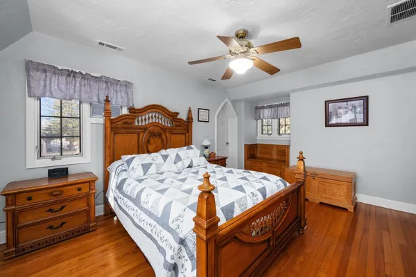 a bedroom with a bed and a dresser