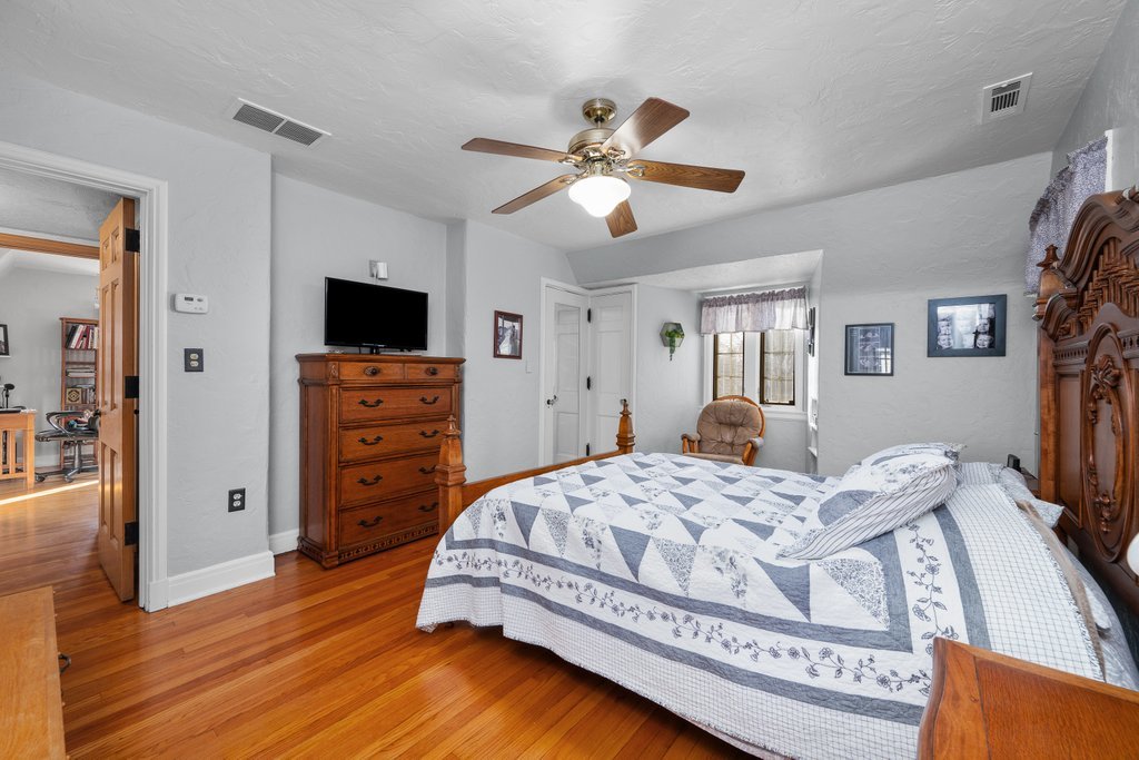 215 West Prospect Street Kewanee, IL 61443 - Photo 36 of 53 a bedroom with a bed and wooden floor