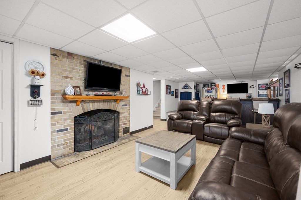 215 West Prospect Street Kewanee, IL 61443 - Photo 45 of 53 a living room with furniture a flat screen tv and a fireplace
