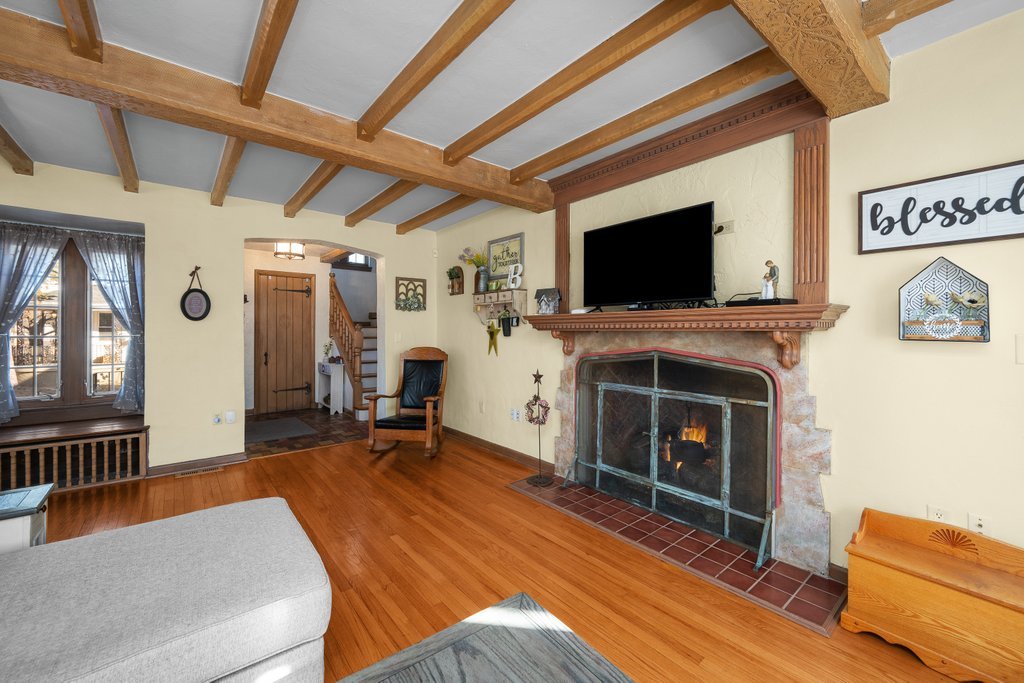 215 West Prospect Street Kewanee, IL 61443 - Photo 6 of 53 a living room with furniture a flat screen tv and a fireplace