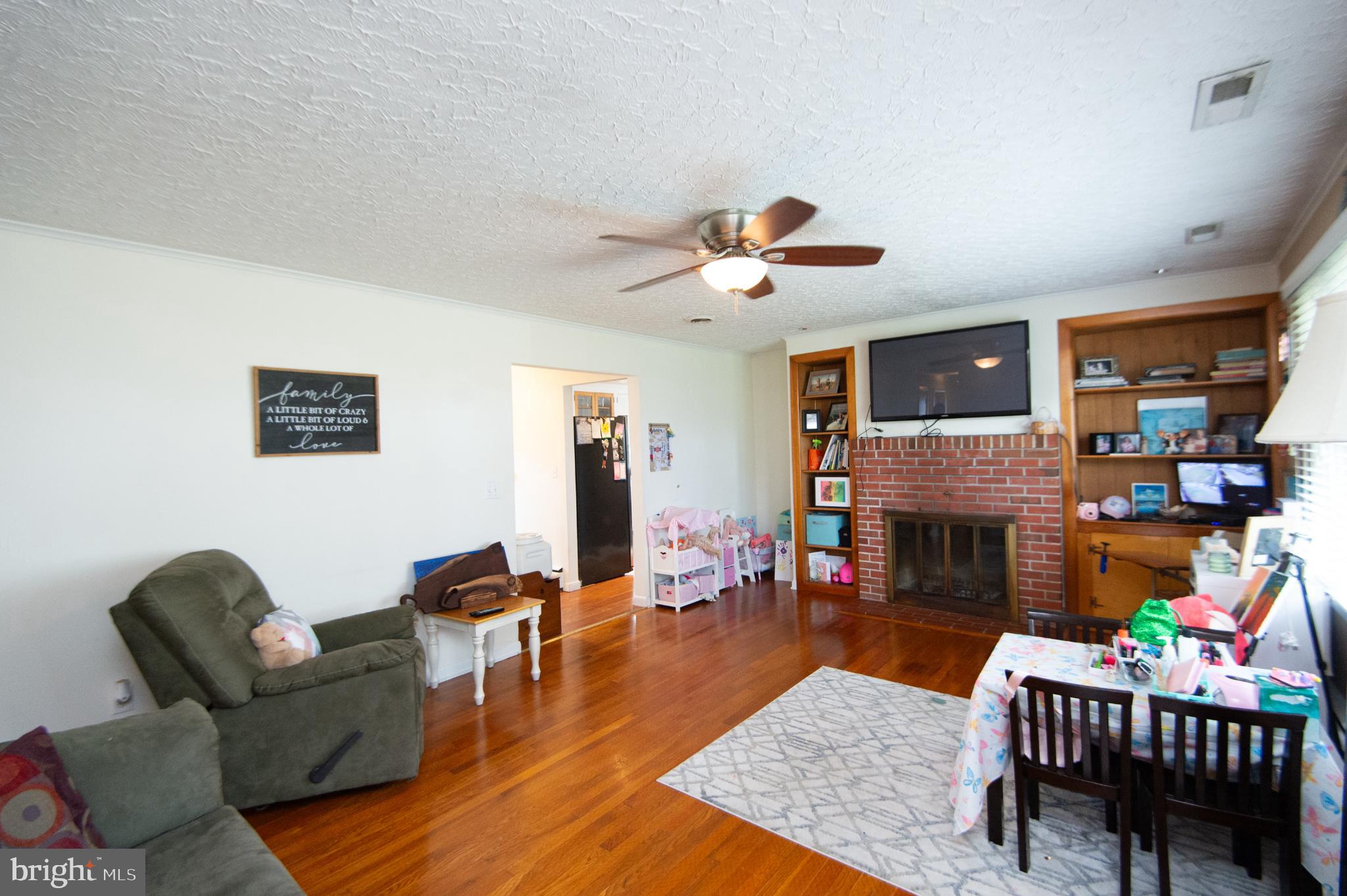 4909 Ravenwood Road Vienna, MD 21869 - Photo 12 of 27 Cozy living space with warm wooden floors.