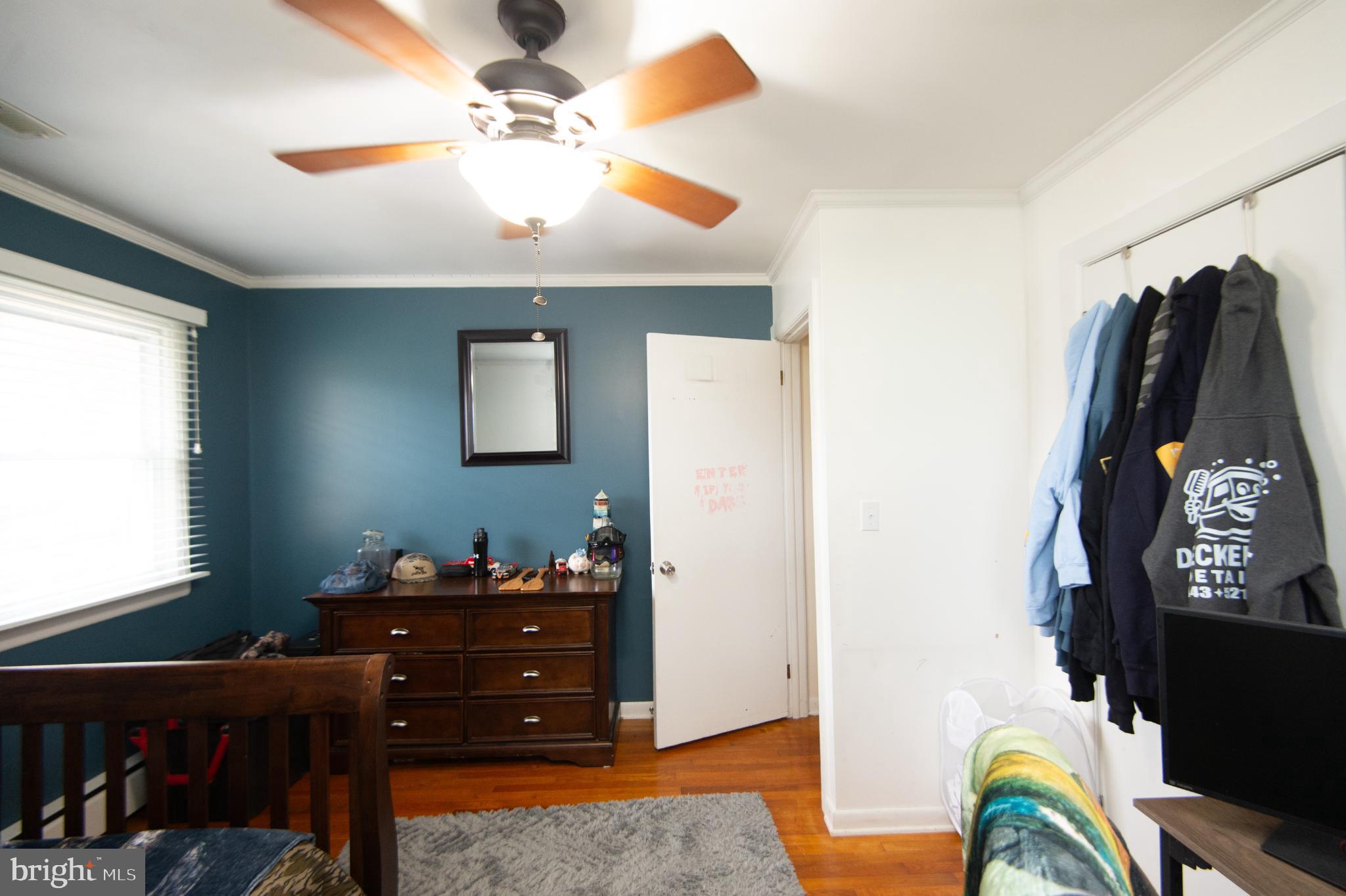 4909 Ravenwood Road Vienna, MD 21869 - Photo 18 of 27 Cozy bedroom with a calming blue hue.