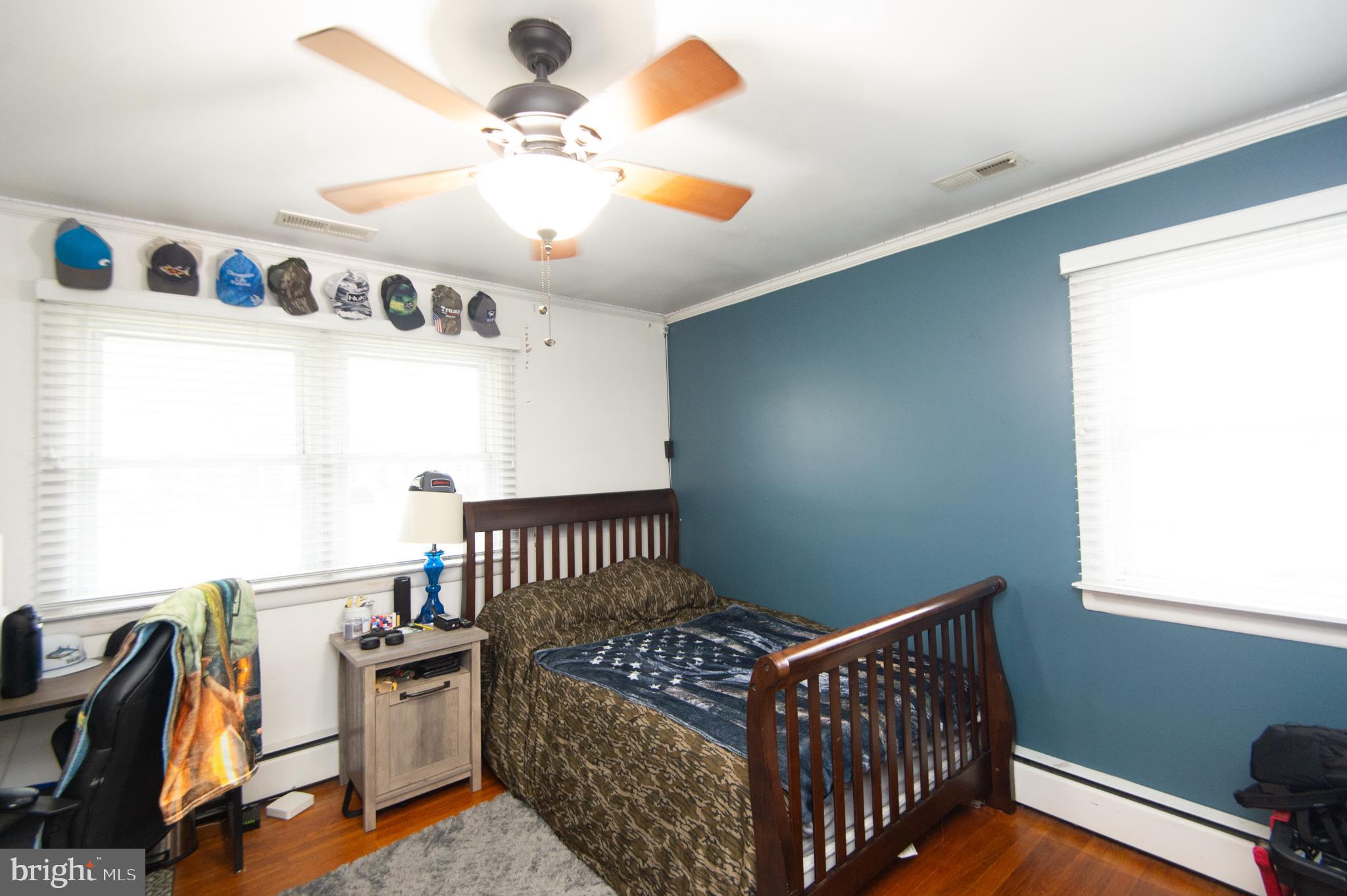 4909 Ravenwood Road Vienna, MD 21869 - Photo 19 of 27 Cozy bedroom with a calming color palette.