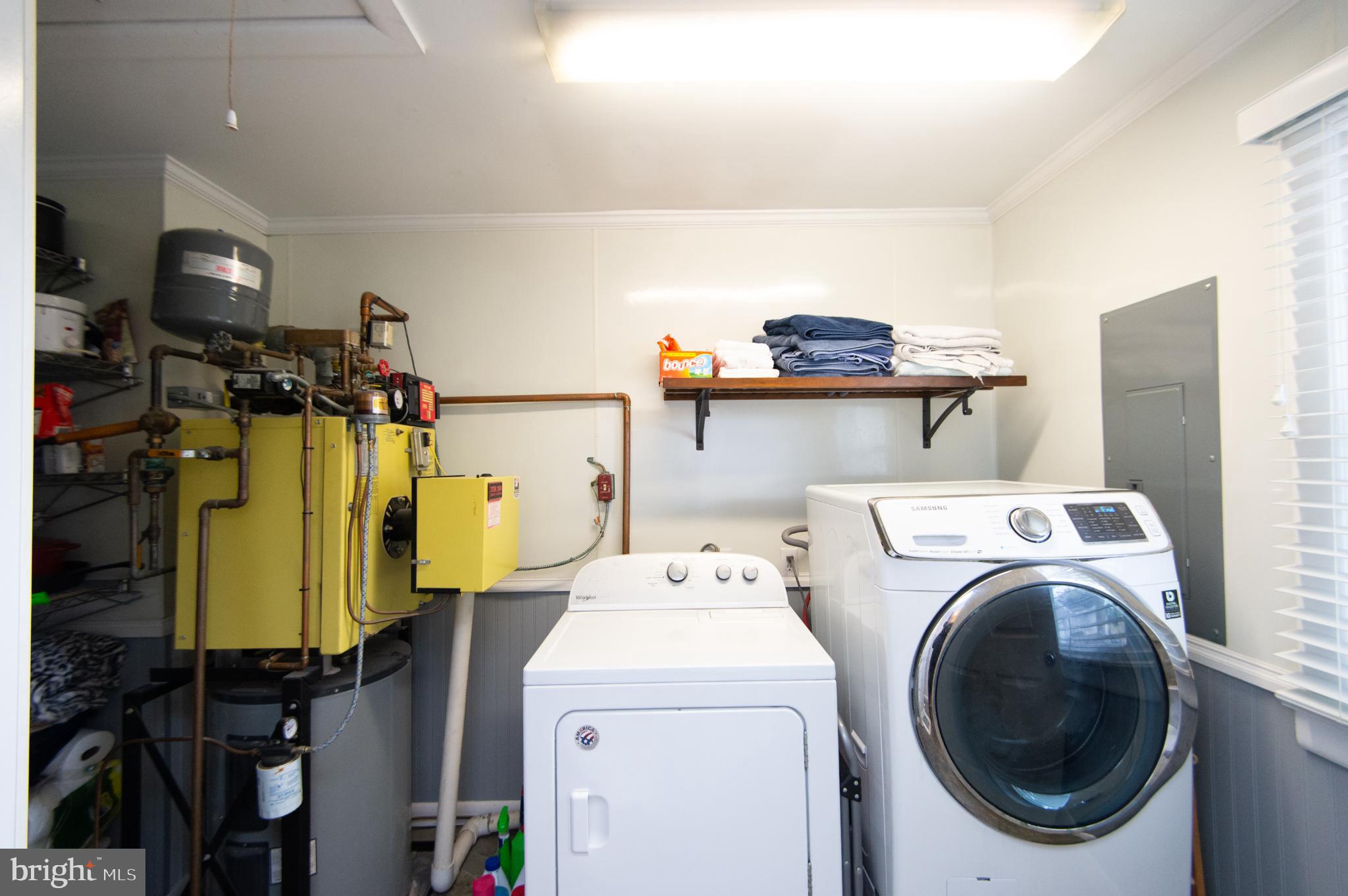 4909 Ravenwood Road Vienna, MD 21869 - Photo 22 of 27 Functional laundry space with modern appliances.