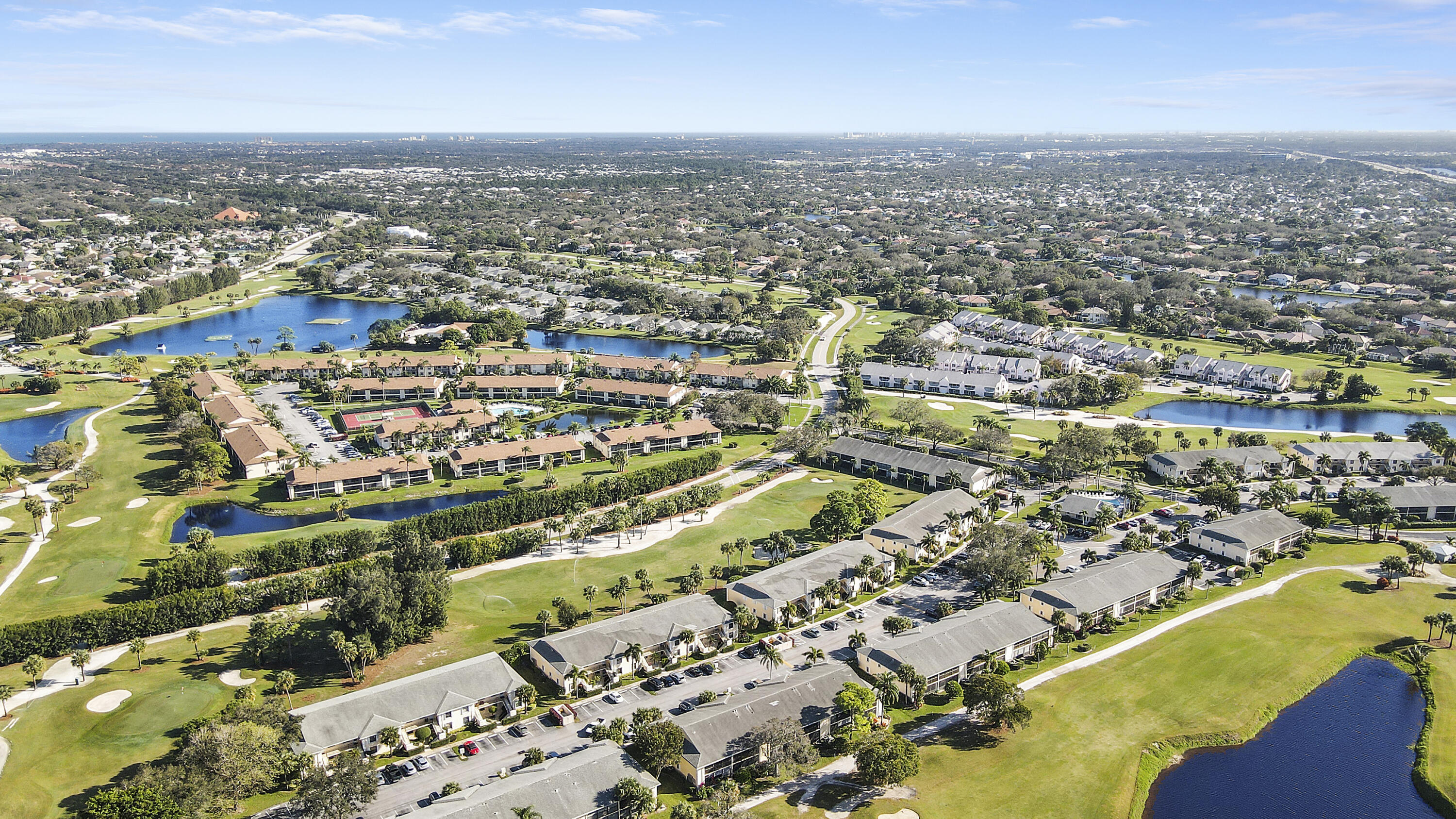 1112 Keystone Drive, Unit A Jupiter, FL 33458 - Photo 32 of 41 an aerial view of residential houses with outdoor space