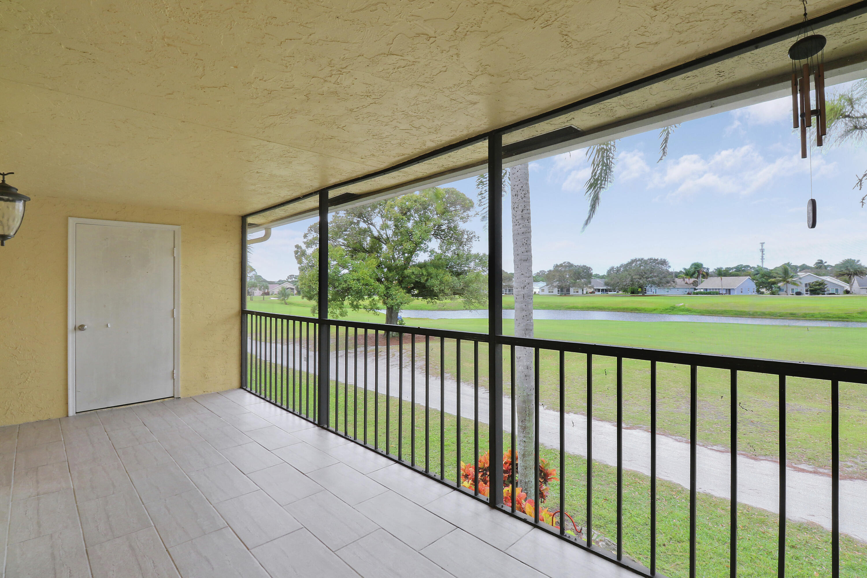1112 Keystone Drive, Unit A Jupiter, FL 33458 - Photo 37 of 41 a view of a porch with a yard