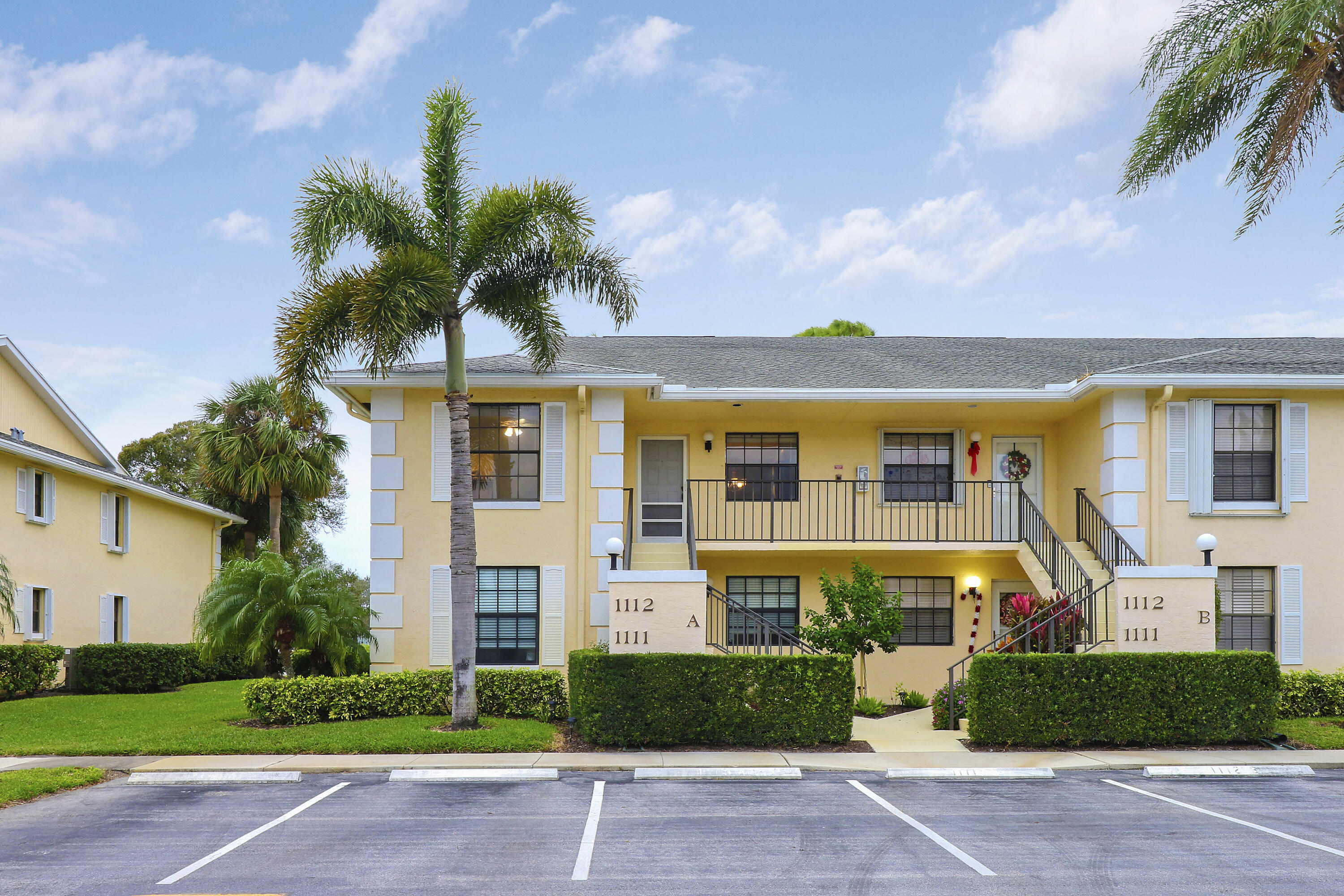 1112 Keystone Drive, Unit A Jupiter, FL 33458 - Photo 41 of 41 a front view of a house with a garden