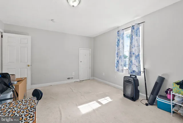 a view of livingroom with furniture and window