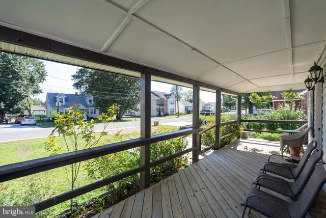 a view of two chairs in a balcony