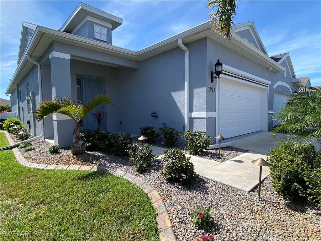 1927 Nottingham Trail Punta Gorda, FL 33980 - Photo 2 of 35 a view of a chair and table in backyard of the house