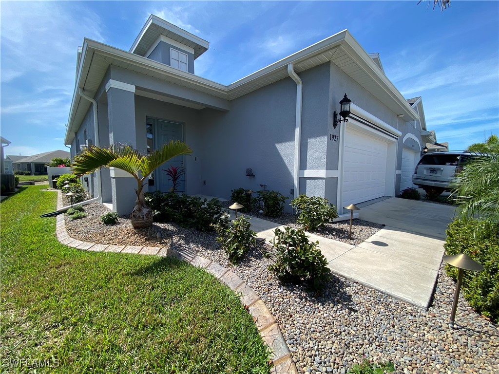 1927 Nottingham Trail Punta Gorda, FL 33980 - Photo 24 of 35 a front view of a house with garden