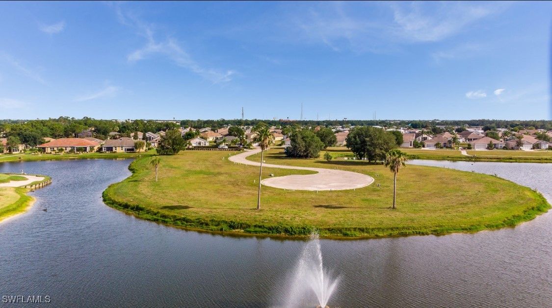 1927 Nottingham Trail Punta Gorda, FL 33980 - Photo 35 of 35 a view of a swimming pool with a table and chairs