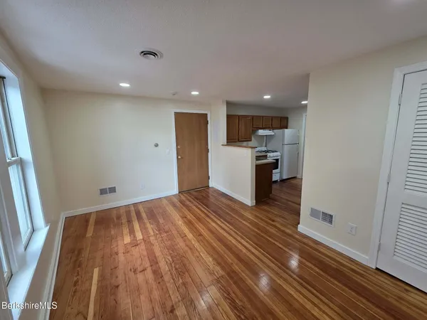 a view of kitchen and wooden floor