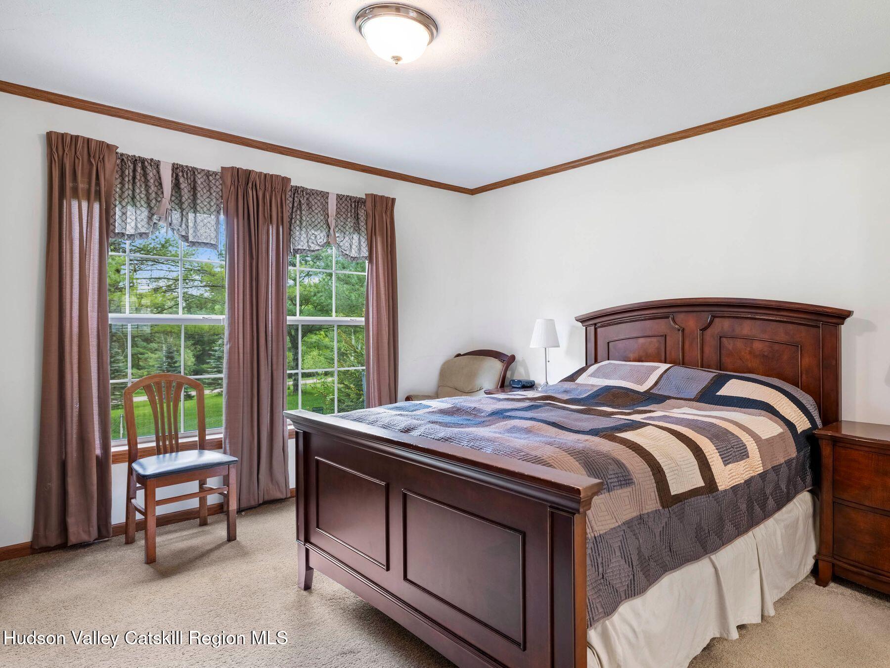 137 Mountain Pond View Road Gilboa, NY 12076 - Photo 25 of 38 a bedroom with a bed and a window