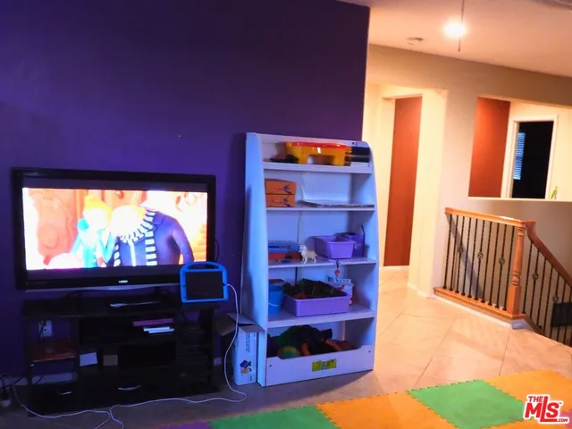 a room with toys and wall painting