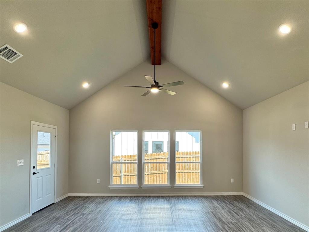300 Rike Road Mabank, TX 75147 - Photo 2 of 18 an empty room with chandelier fan and windows