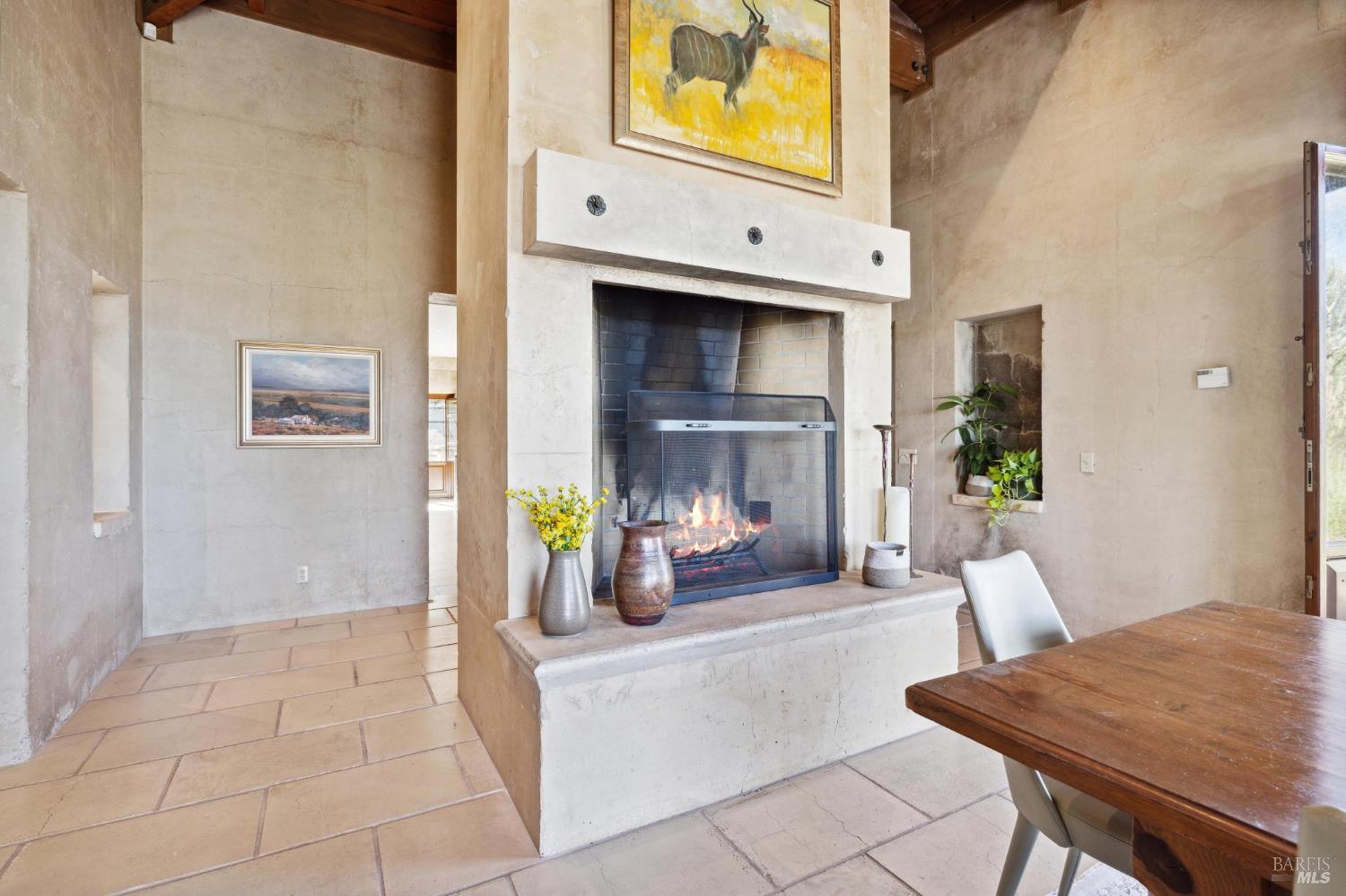 2846 Monticello Road Napa, CA 94558 - Photo 28 of 61 a living room with furniture and a fireplace