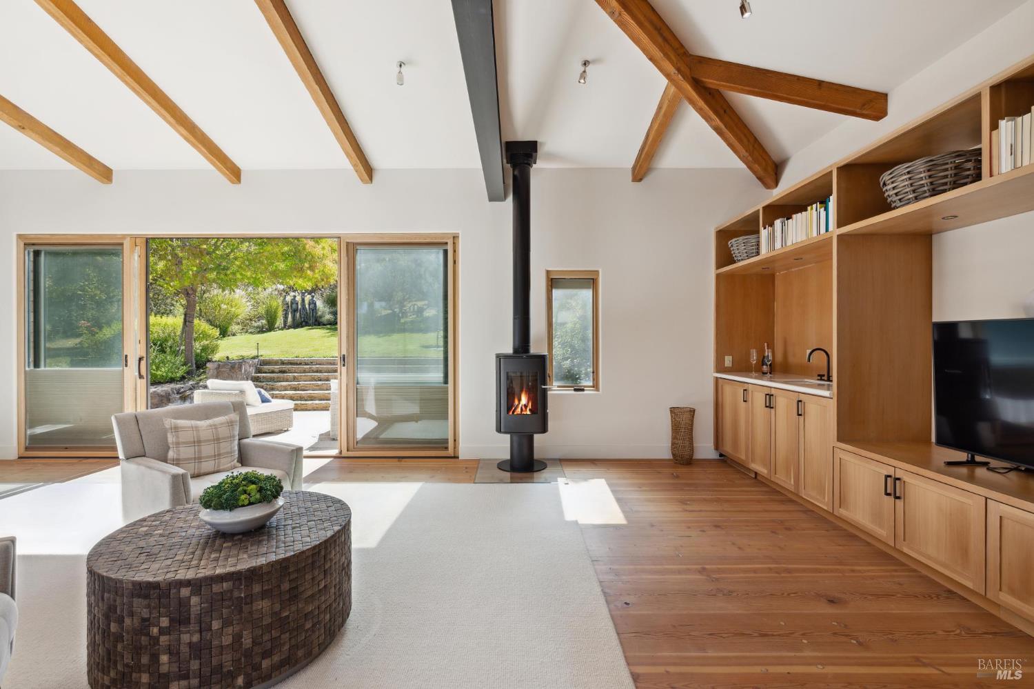 2846 Monticello Road Napa, CA 94558 - Photo 34 of 61 a living room with furniture and a flat screen tv