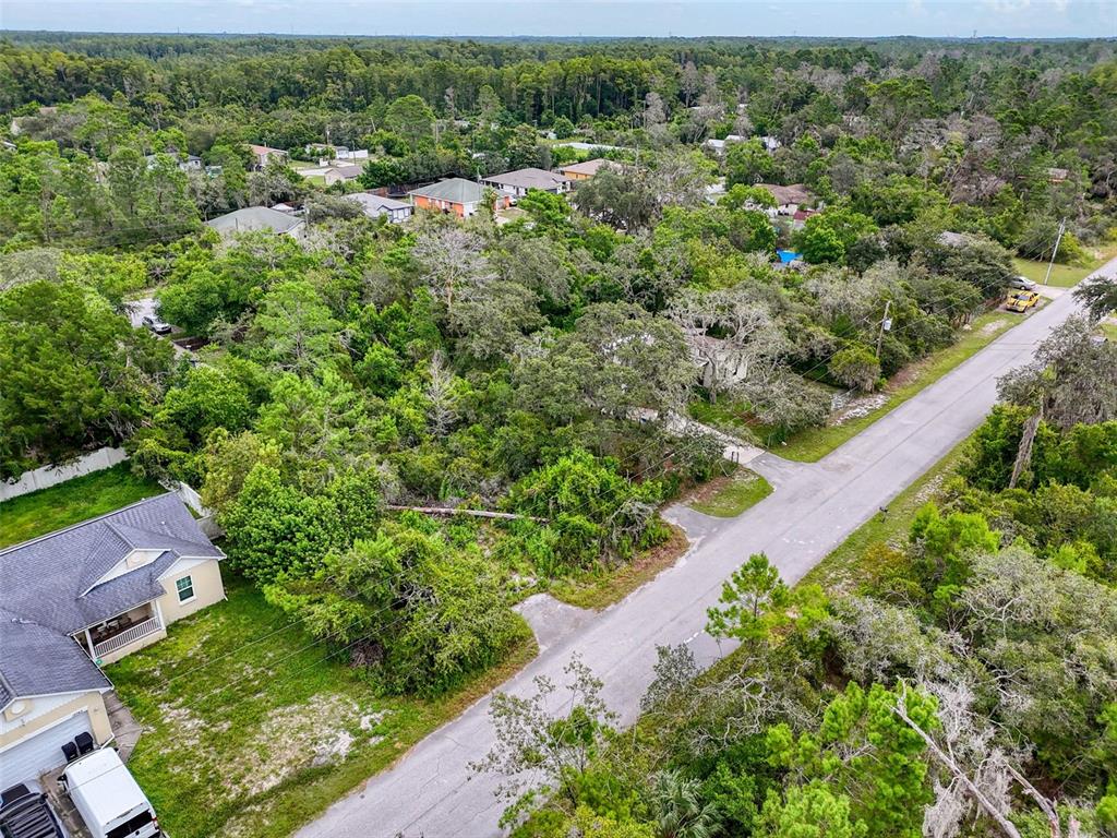 71 St 72 & 73 New Port New Port Richey, FL 34654 - Photo 18 of 37 an aerial view of multiple houses with yard