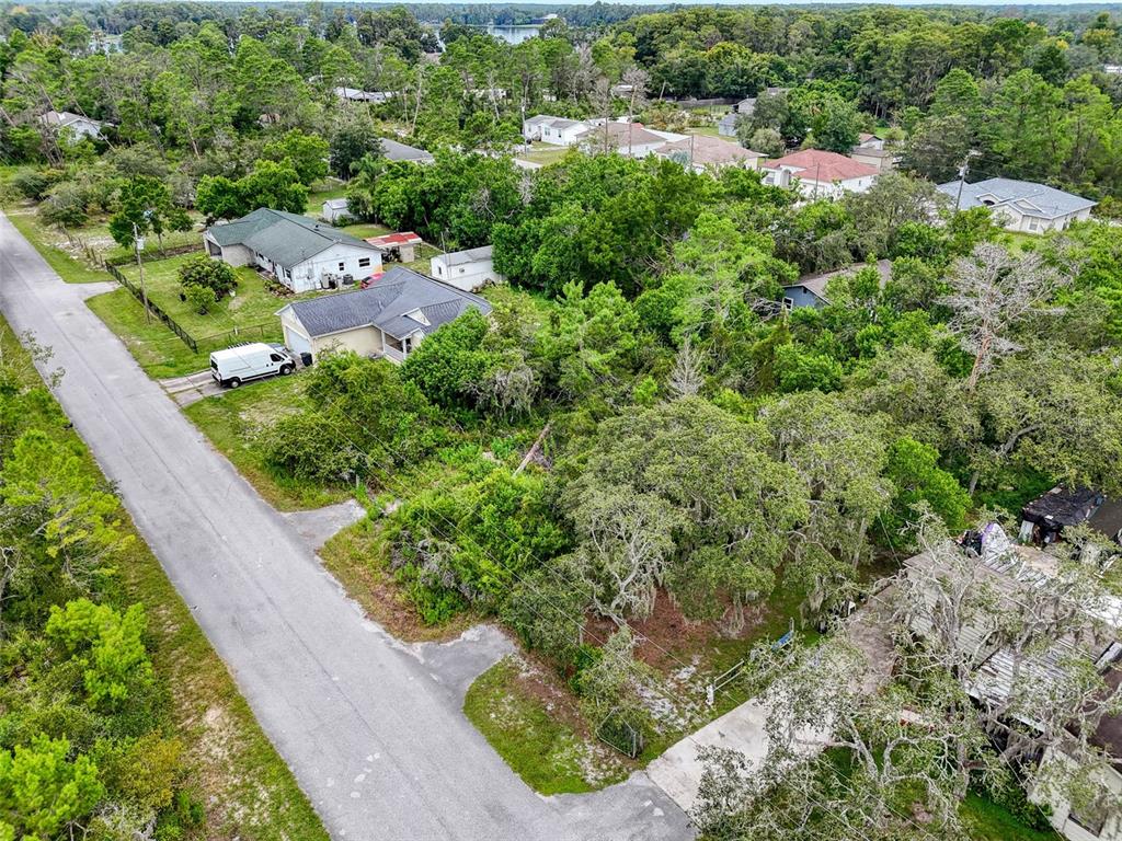 71 St 72 & 73 New Port New Port Richey, FL 34654 - Photo 22 of 37 an aerial view of a house with a yard