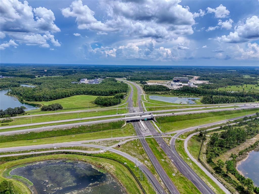 71 St 72 & 73 New Port New Port Richey, FL 34654 - Photo 36 of 37 a view of a swimming pool with a garden and trees