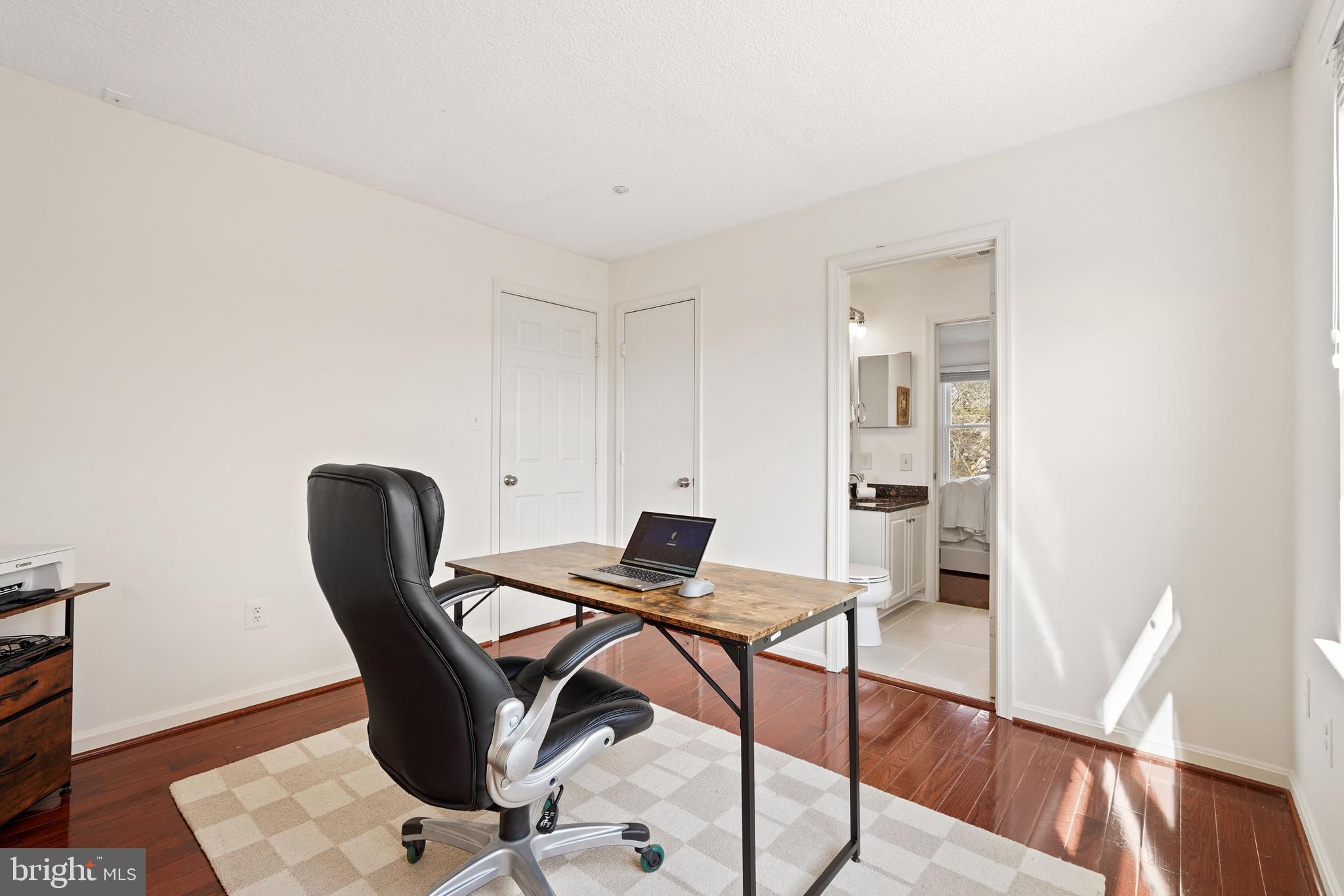 12901 Churchill Ridge Circle, Unit 13 Germantown, MD 20874 - Photo 22 of 44 a view of a workspace with furniture and wooden floor