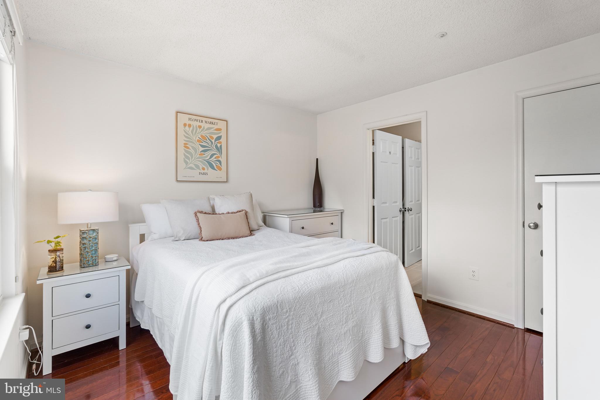 12901 Churchill Ridge Circle, Unit 13 Germantown, MD 20874 - Photo 27 of 44 a bedroom with a bed and a painting on the wall