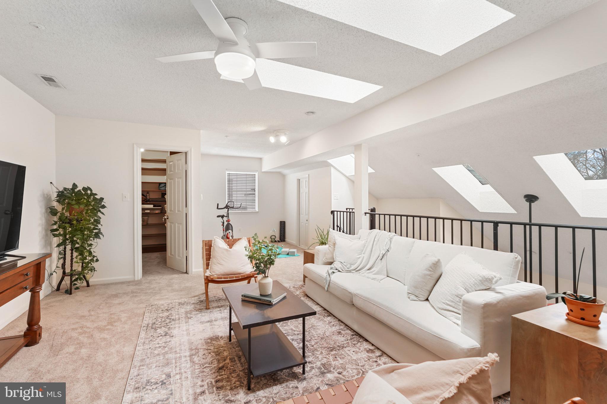 12901 Churchill Ridge Circle, Unit 13 Germantown, MD 20874 - Photo 30 of 44 a living room with furniture potted plant and a window
