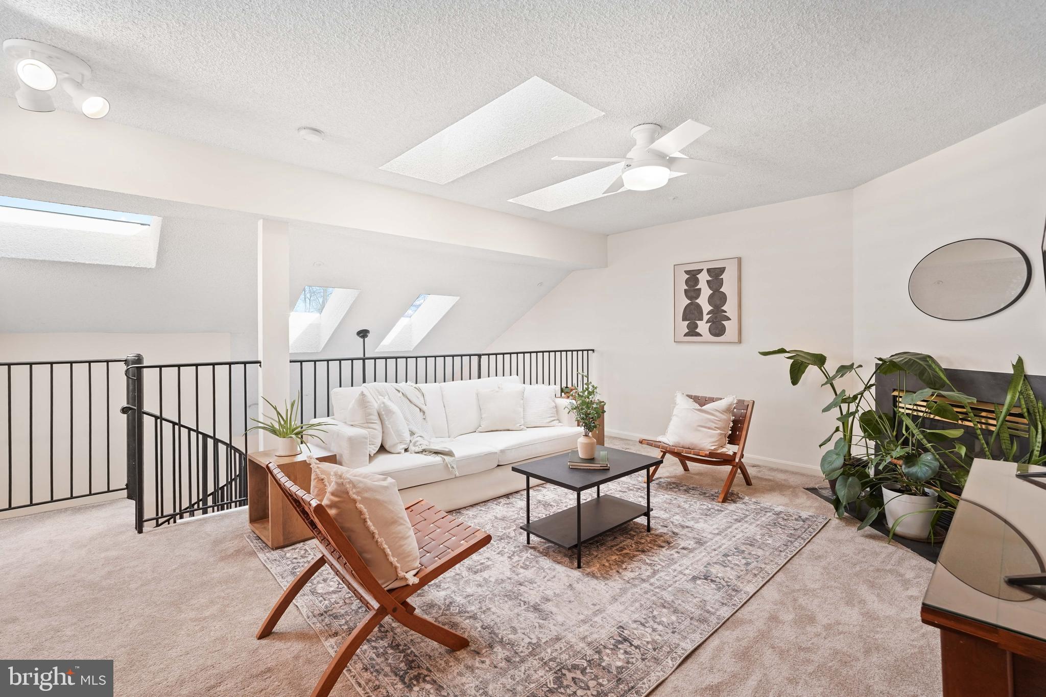 12901 Churchill Ridge Circle, Unit 13 Germantown, MD 20874 - Photo 31 of 44 a living room with furniture a rug and a chandelier