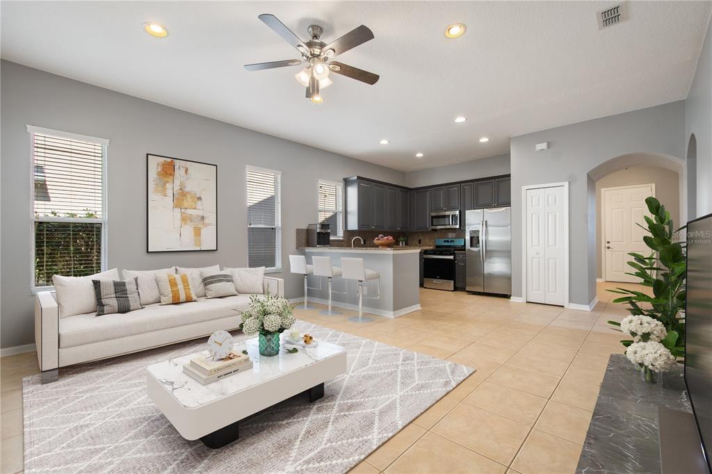 13118 Sunkiss Loop Windermere, FL 34786 - Photo 11 of 52 a living room with furniture and kitchen view