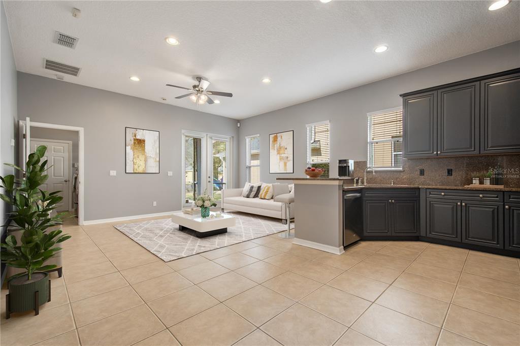13118 Sunkiss Loop Windermere, FL 34786 - Photo 15 of 52 a kitchen with kitchen island granite countertop a sink counter top space and appliances