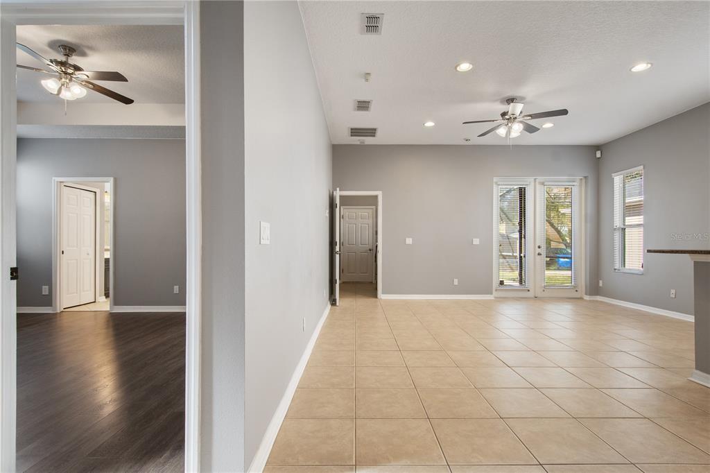 13118 Sunkiss Loop Windermere, FL 34786 - Photo 19 of 52 an empty room with wooden floor and a ceiling fan