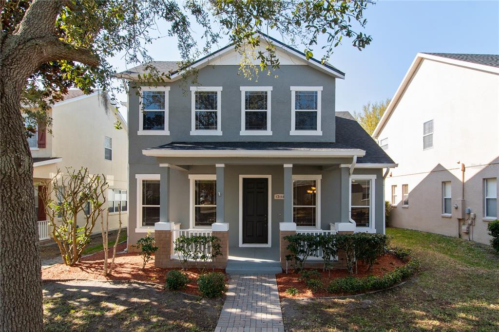 13118 Sunkiss Loop Windermere, FL 34786 - Photo 2 of 52 a front view of a house with a yard